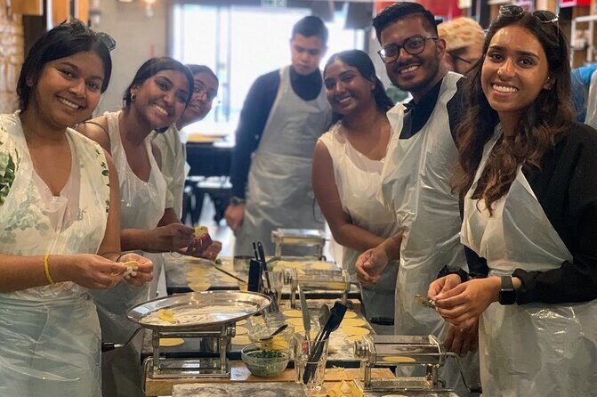 Verona: Pasta and Tiramisu Cooking Class With Free Flowing Wine - Where it happens: a restaurant setup near the Arena